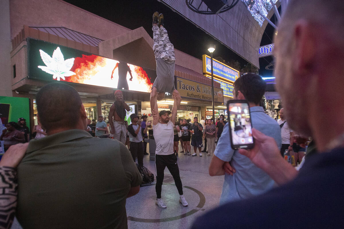 A group of buskers perform at the Fremont Street Experience Monday, July 1, 2024, in Las Vegas. ...