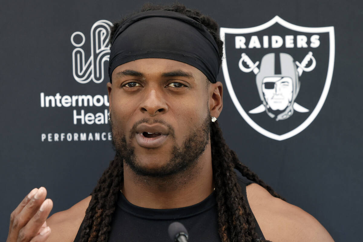 Raiders wide receiver Davante Adams addresses the media after an NFL football practice at the I ...