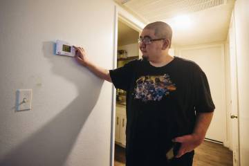 Jose Alvarez shows the theromstat inside of his apartment on Sunday, July 14, 2024, in Las Vega ...