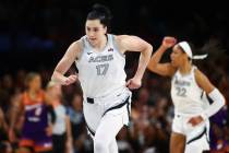 Las Vegas Aces center Megan Gustafson (17) runs up the court during the first half of a WNBA ba ...