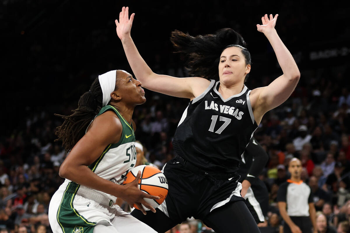 Seattle Storm forward Nneka Ogwumike, left, dribbles up the court against Las Vegas Aces center ...