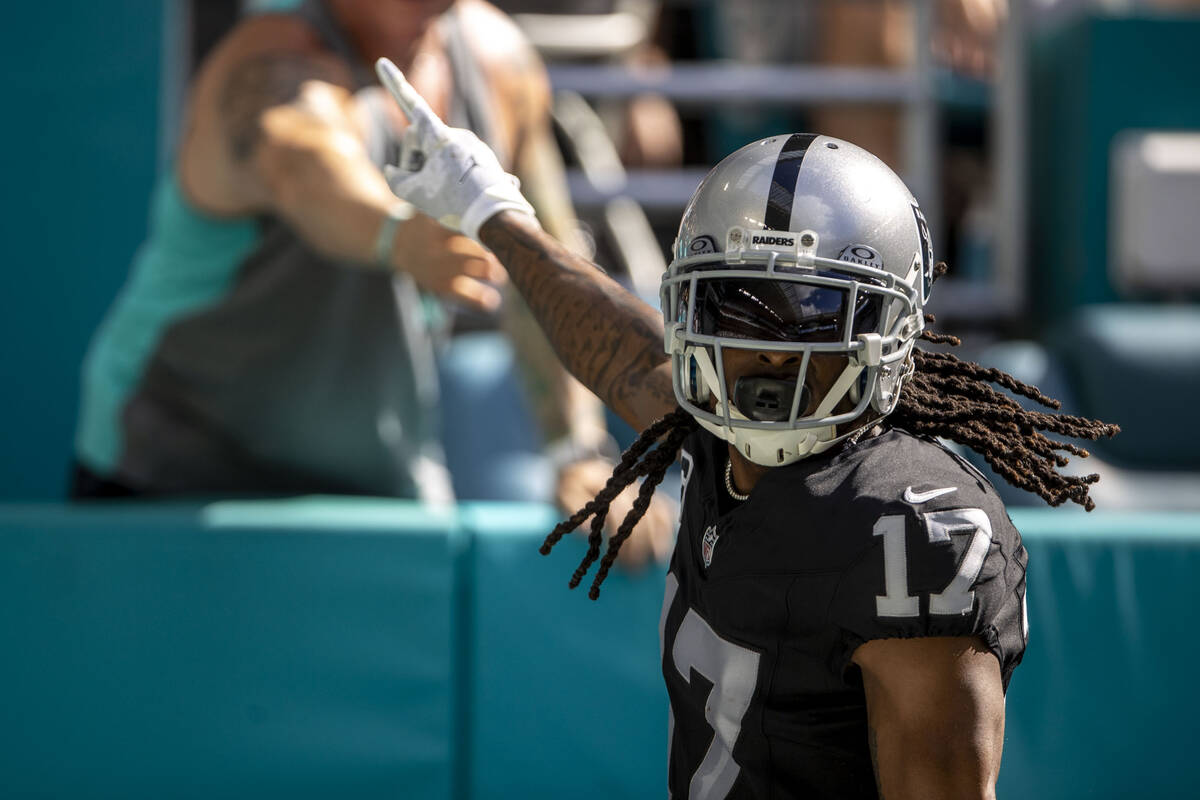 Raiders wide receiver Davante Adams (17) celebrates his touchdown score during the first half o ...