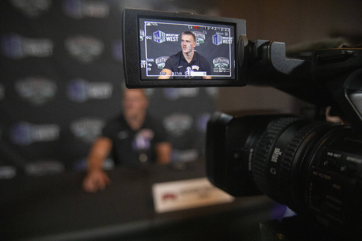 UNLV Rebels linebacker Jackson Woodard, seen through a video camera screen, speaks during the M ...