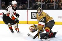 Golden Knights goaltender Adin Hill (33) saves the puck against Ducks center Ryan Strome (16) d ...