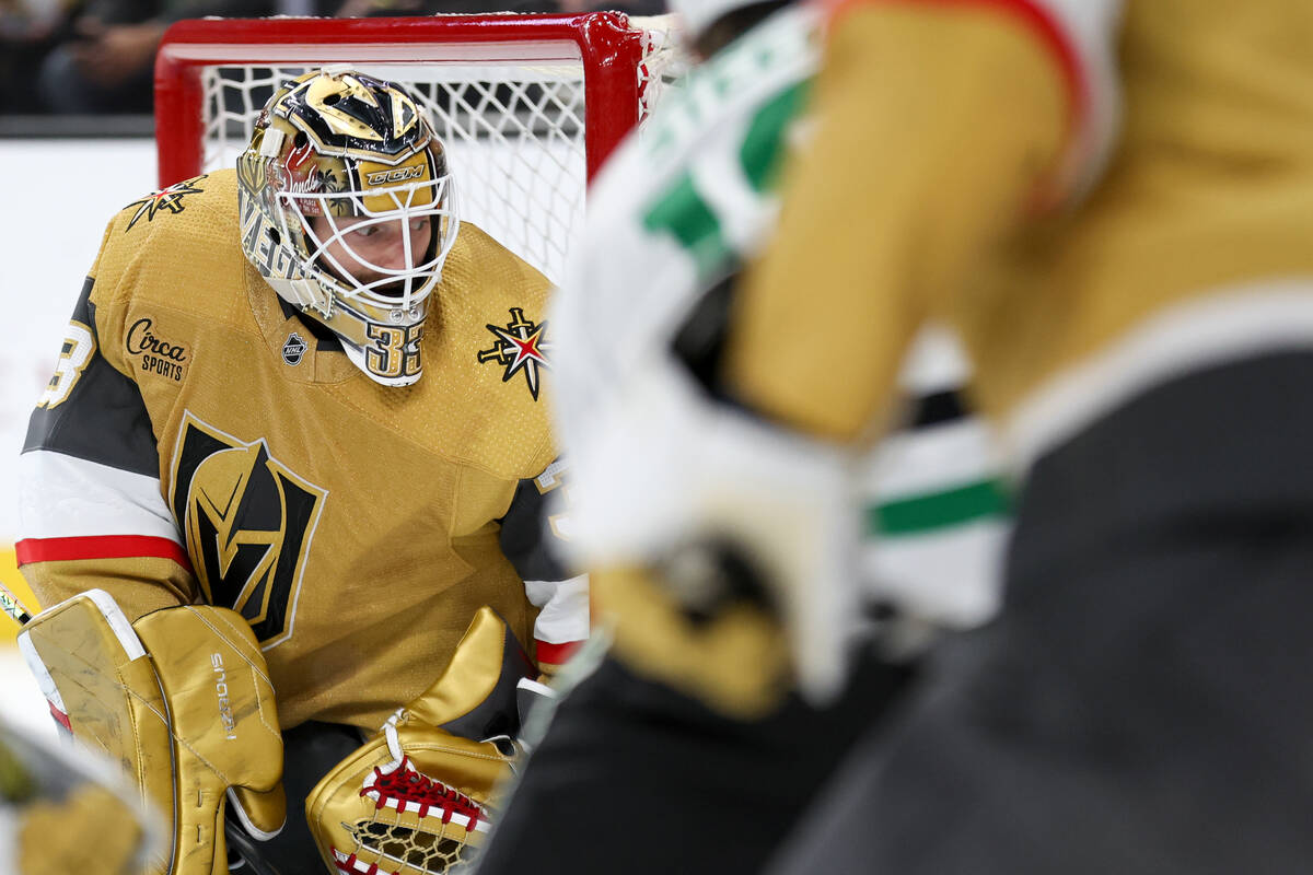 Golden Knights goaltender Adin Hill (33) looks back after making a save during the second perio ...