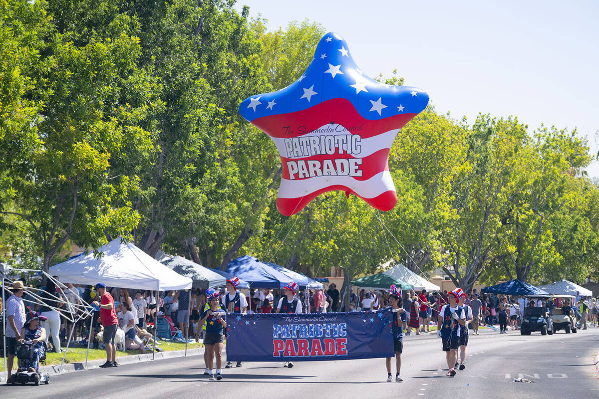 The parade included dozens of floats, giant inflatable balloons, veteran and military organizat ...