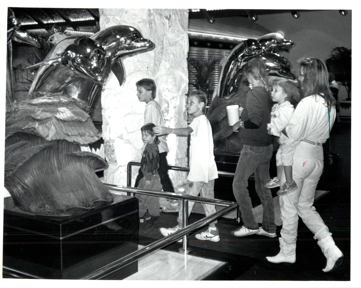 Las Vegas Review-Journal NOV 22, 1989 Sculpted dolphins greet visitors at main entrance of Mir ...