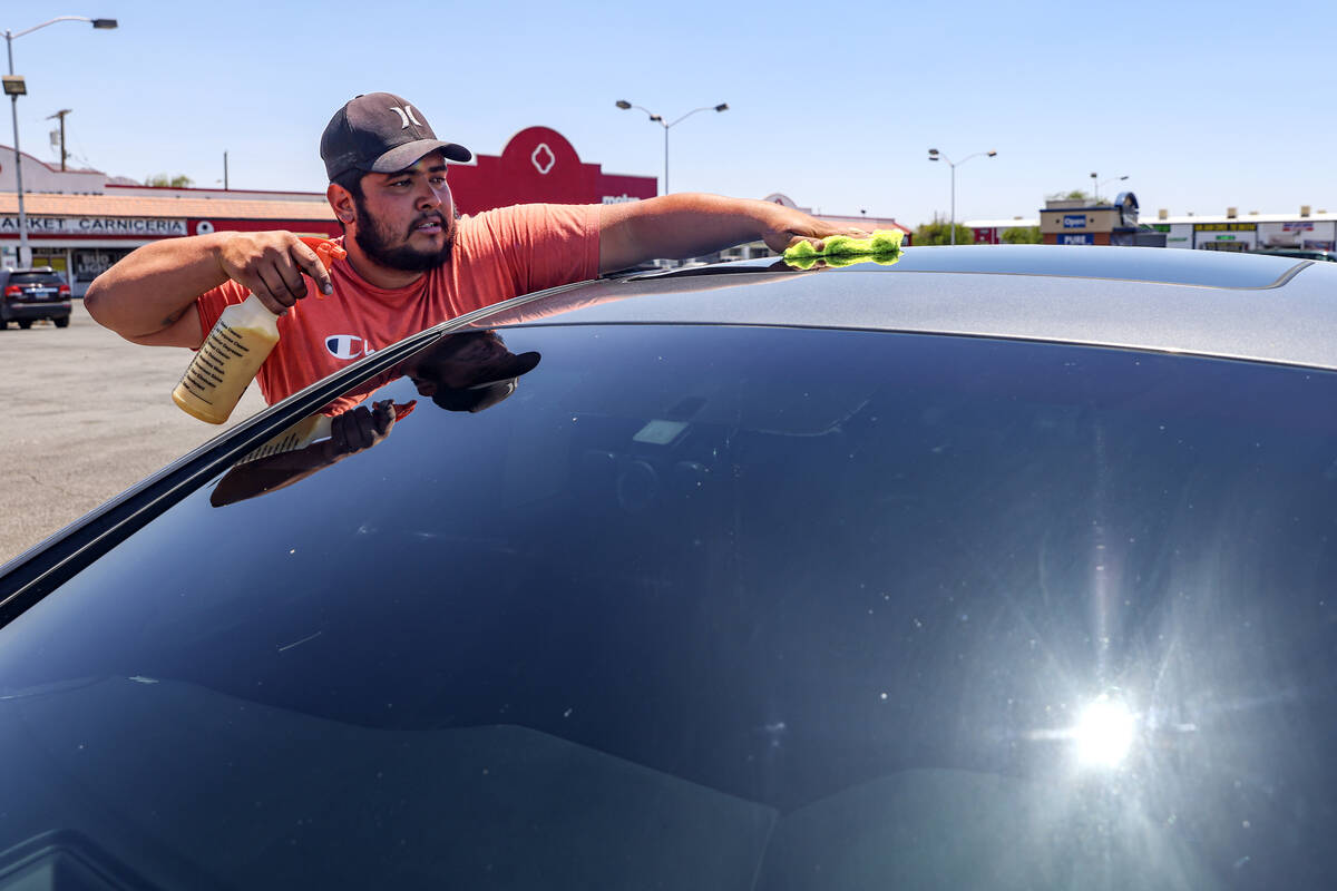 Rodolfo Moran cleans a car at Cuellar’s Car Wash in East Las Vegas, Monday, July 8, 2024 ...