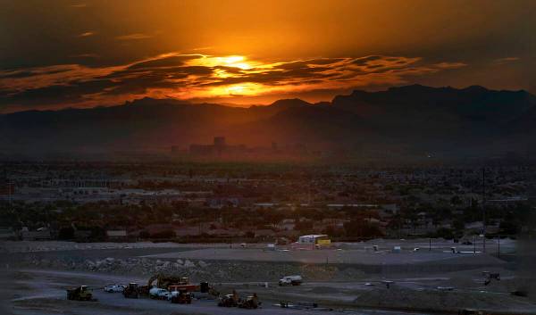 The sun rises over the valley and Strip on another high temperature day on Thursday, July 20, 2 ...