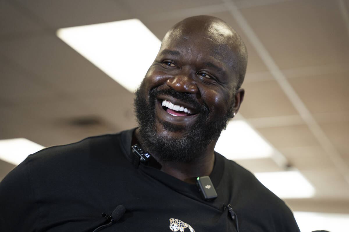 Shaquille O'Neal laughs as he is interviewed by the media after a press conference at Mario C. ...