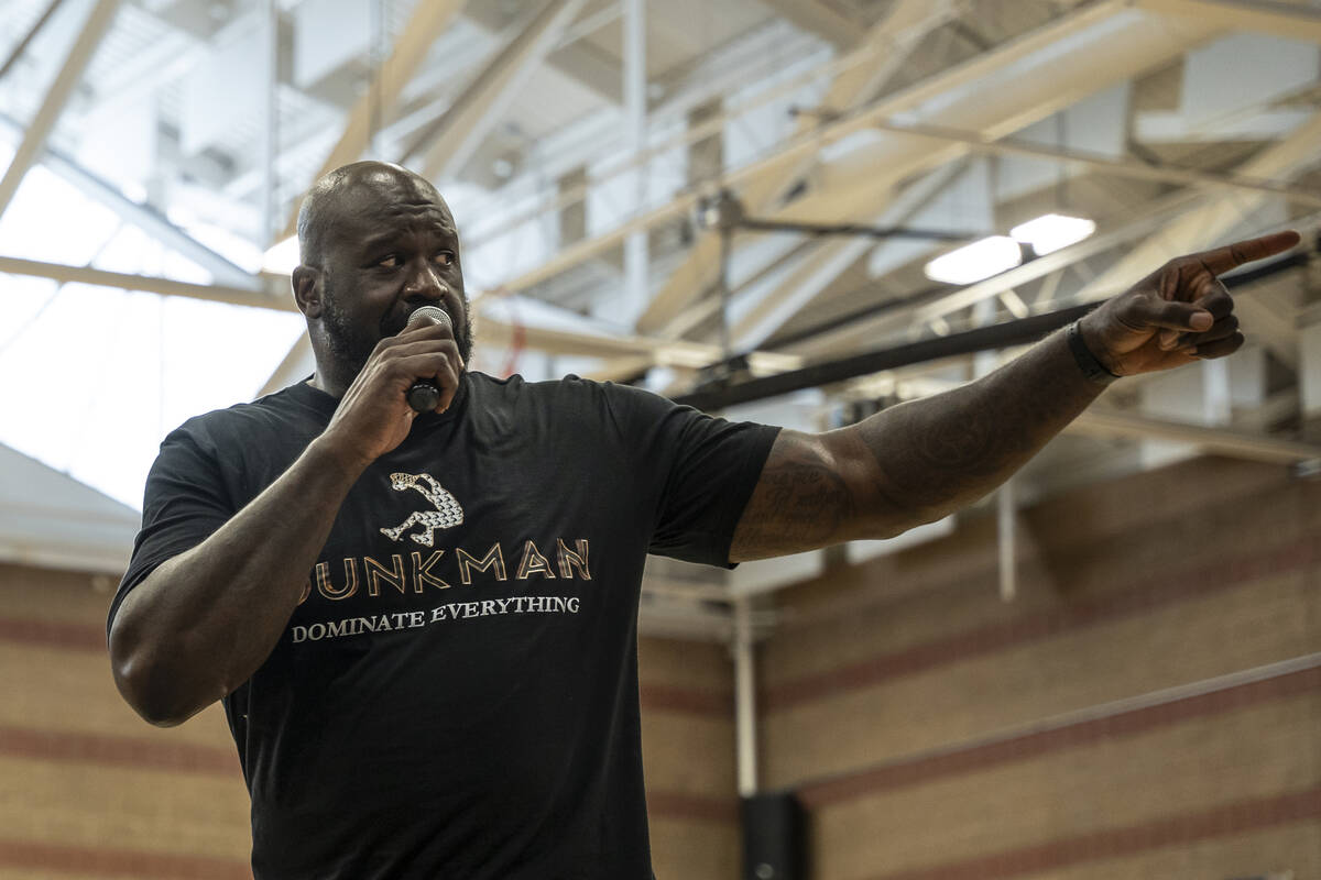 Shaquille O'Neal points to the DJ and instructs him to start playing music during a Shaq-to-Sch ...