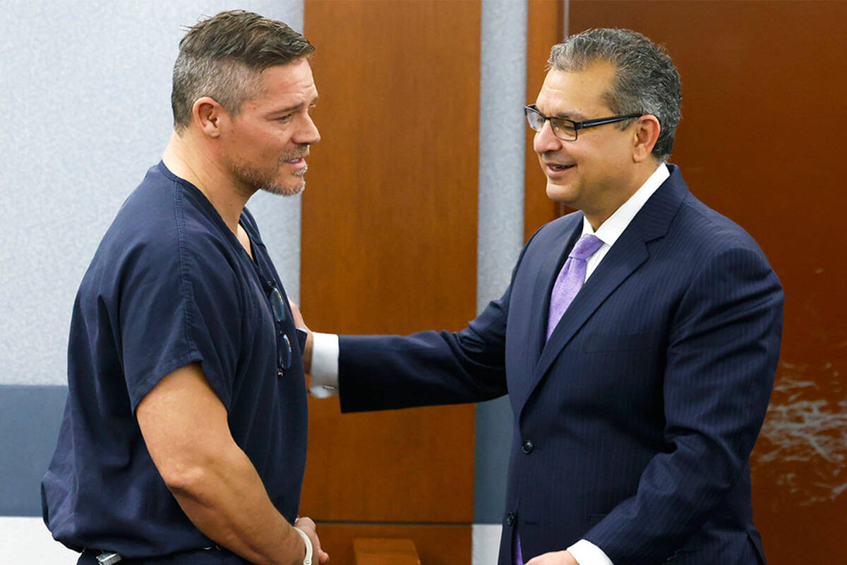 Defense attorney Christopher Oram listens to Jose “Chille” DeCastro during a hearing at the ...