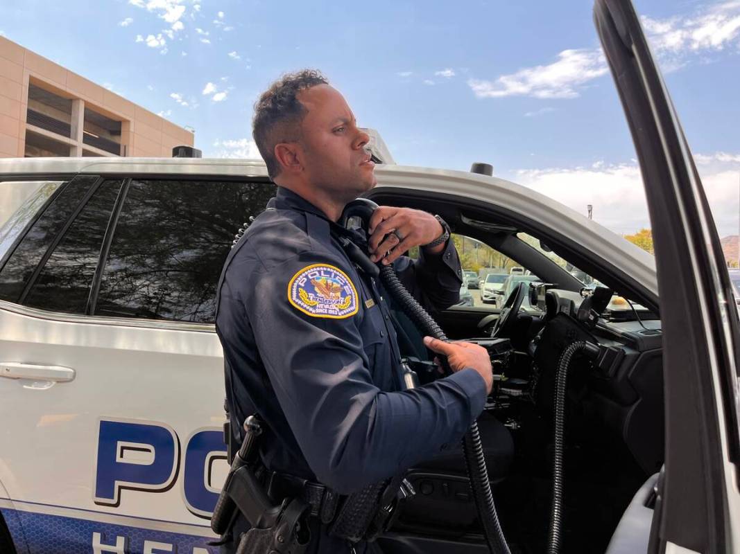 Officer Marcus McCrary of the Henderson Police Department demonstrates how to use his "Cool Cop ...