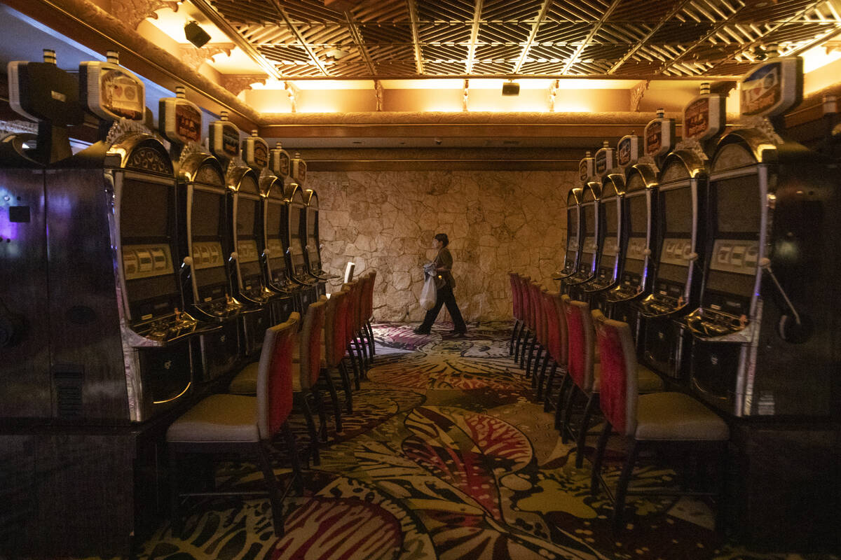 A custodian cleans old slot machines at The Mirage, Wednesday, July 10, 2024, in Las Vegas. (Da ...