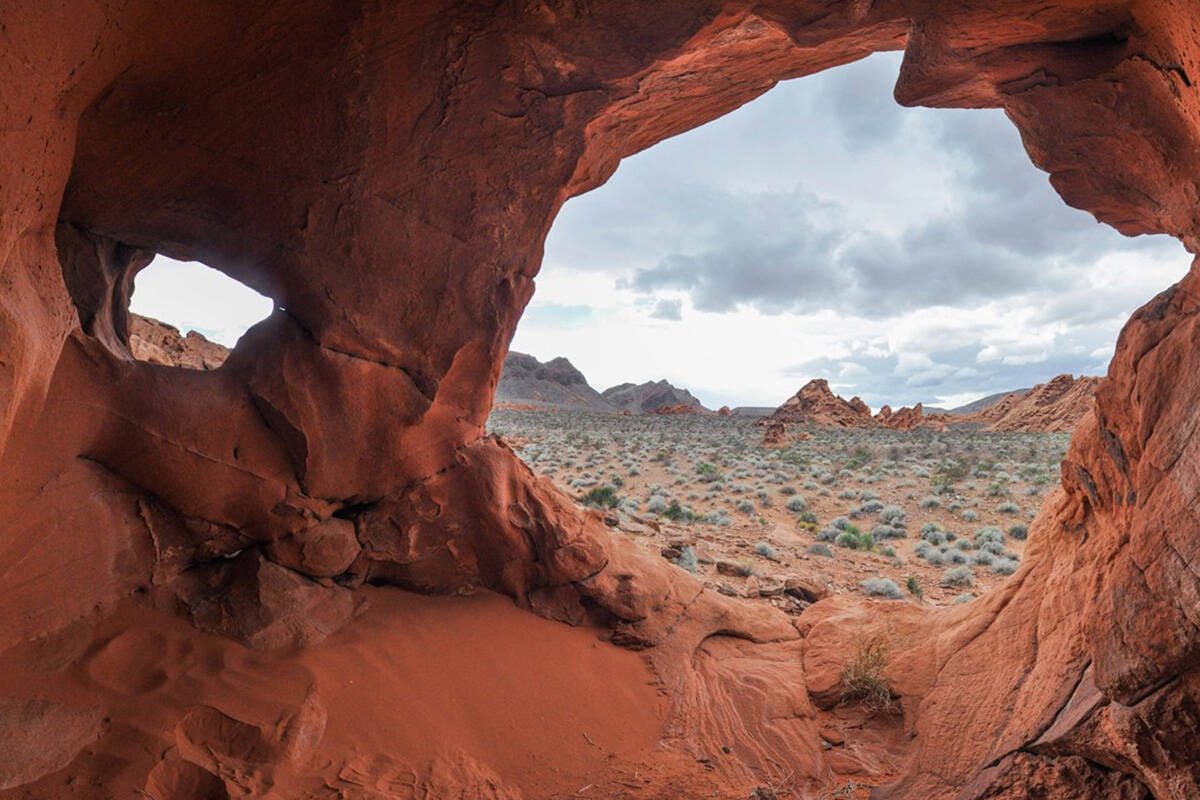 Jutting rocks and natural caves that have been carved out by erosion and weathering along Redst ...