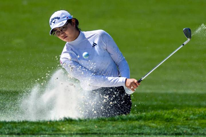 Rose Zhang digs out of a sand trap on hole #7 during the second day of the LPGA T-Mobile Match ...