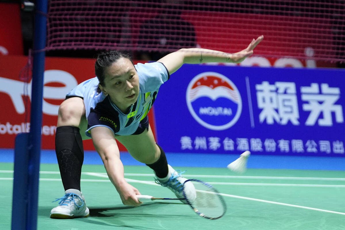 Beiwen Zhang of the U.S. plays a return during a badminton game of the women's singles against ...