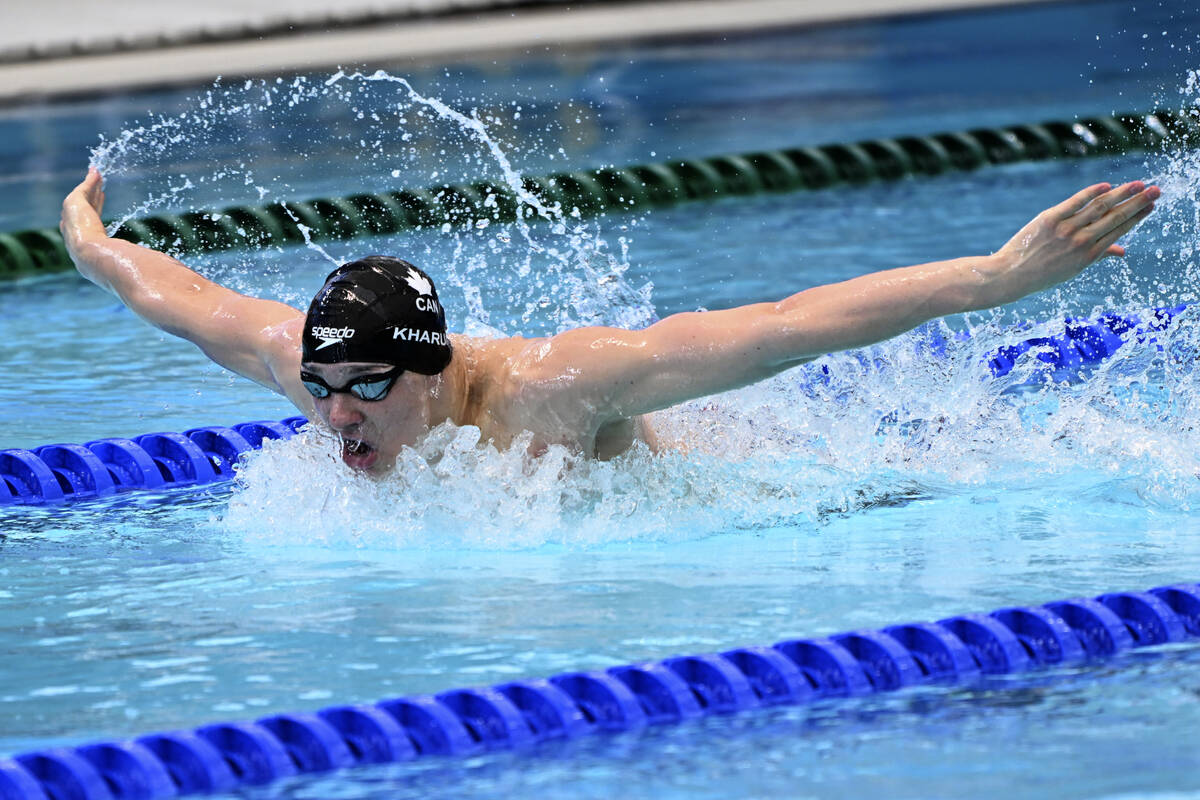 Ilya Kharun of Canada swims in his heat of the men's 100m butterfly during the world swimming s ...