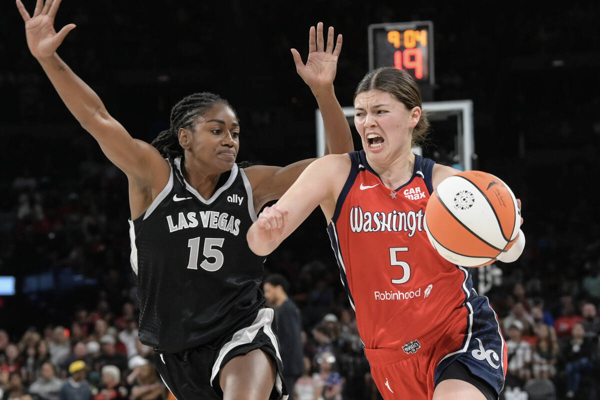 Las Vegas Aces guard Tiffany Hayes (15) defends Washington Mystics guard Jade Melbourne (5) dur ...