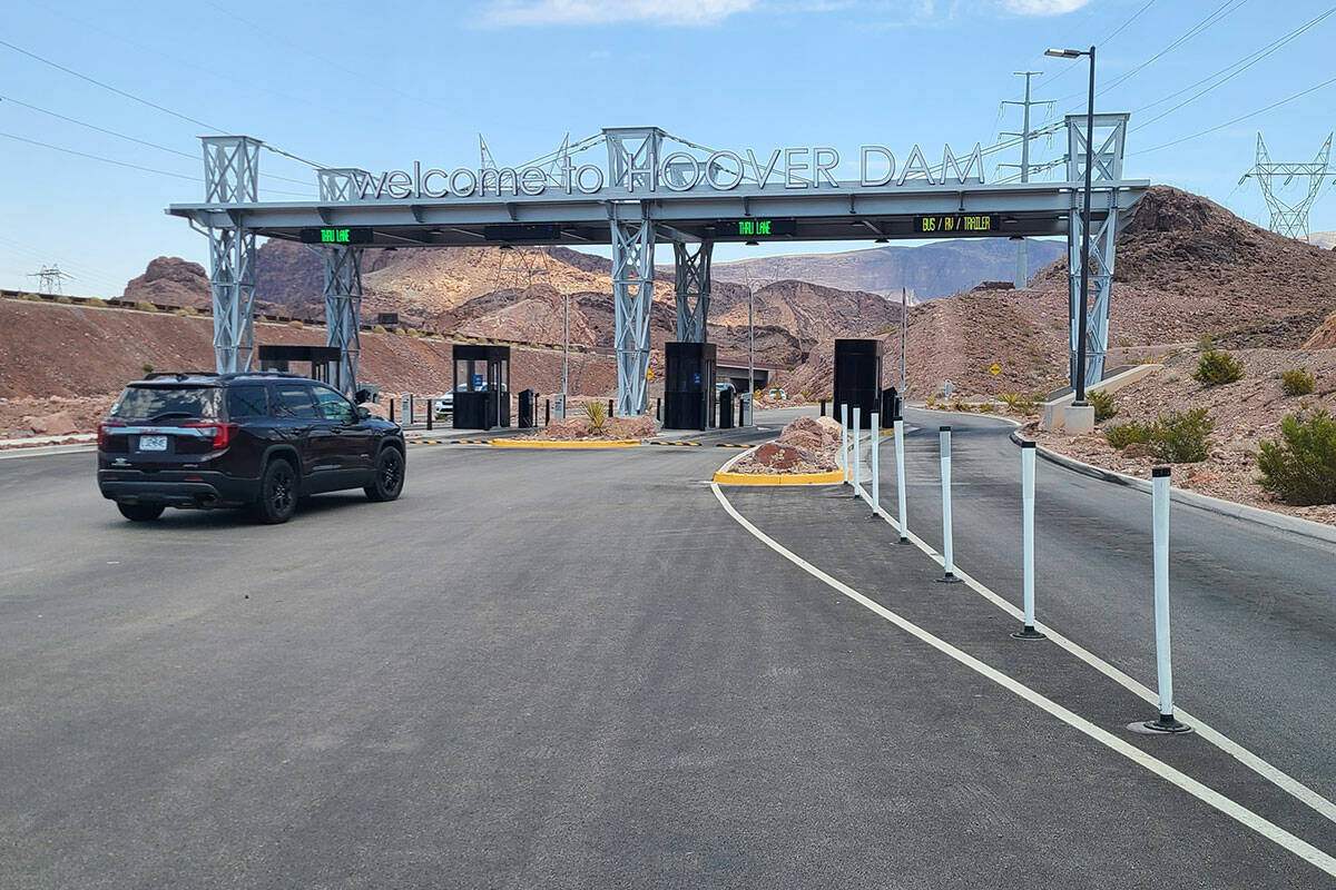 A passenger vehicle prepares to pass through a new toll plaza built near Hoover Dam on July 10, ...