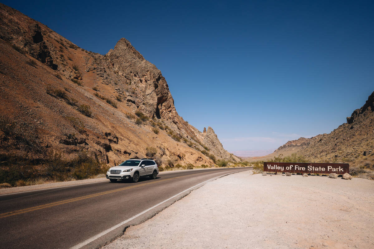 A car leaves Valley of Fire State Park, which is closed off to visitors at the moment, on Thurs ...