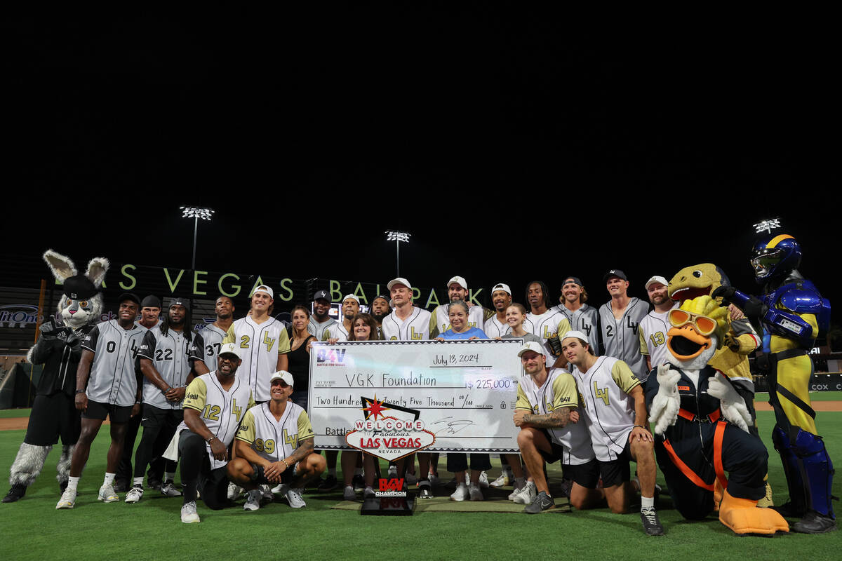 The Golden Knights and the Raiders pose for photos after the annual Battle for Vegas charity so ...