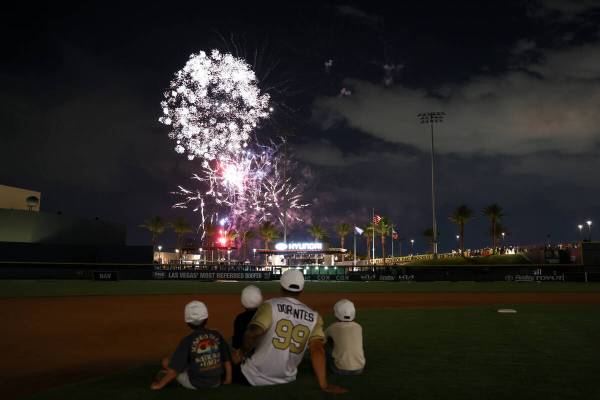 Golden Knights manual therapist Raul Dorantes watches the fireworks with his kids after the ann ...