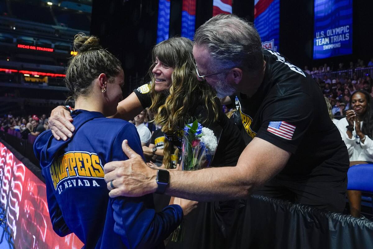 Katie Grimes is congratulated after winning the Women's 400 individual medley finals Monday, Ju ...