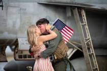 Lindsay Nelson kisses her husband, Robert "Fat Goose" Nelson, after he returned to NA ...