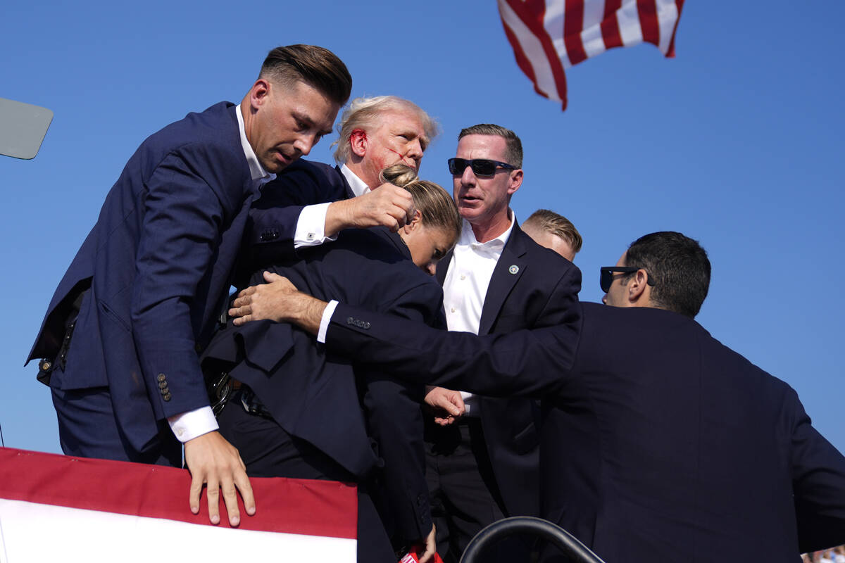 Republican presidential candidate former President Donald Trump is surrounded by U.S. Secret Se ...