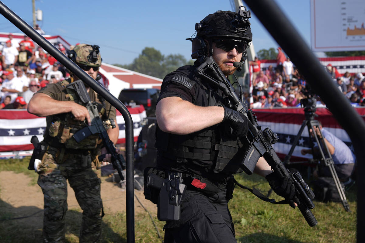 U.S. Secret Service agents surround the stage during a campaign rally with Republican president ...