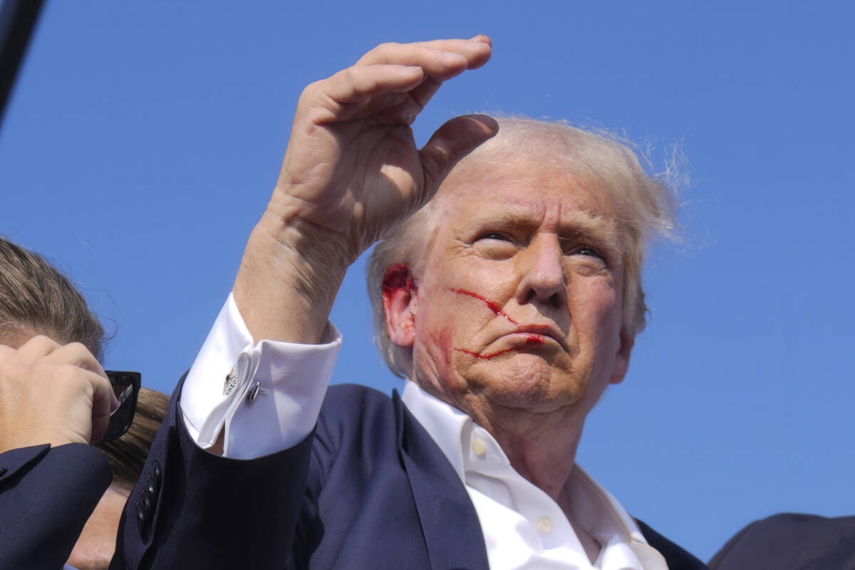 Republican presidential candidate former President Donald Trump waves from the stage as he is s ...