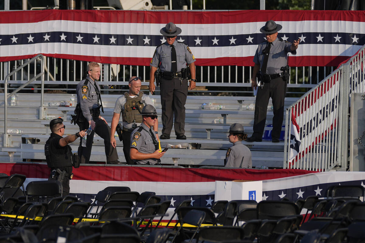 Law enforcement officers gather at the campaign rally site for Republican presidential candidat ...