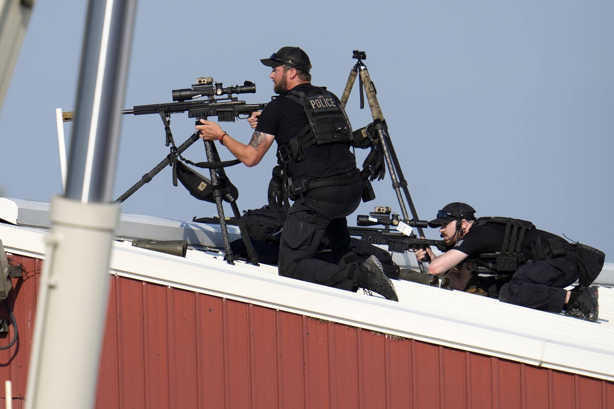 Police snipers return fire after shots were fired while Republican presidential candidate forme ...