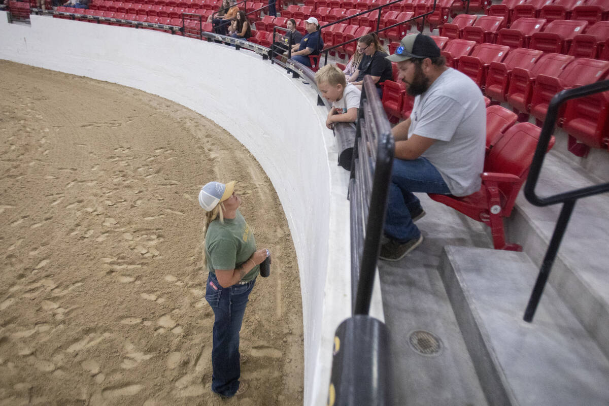 Competitor Katie Scotts, left, of Notus, Idaho, talks to her child Klayton, 5, center, and husb ...