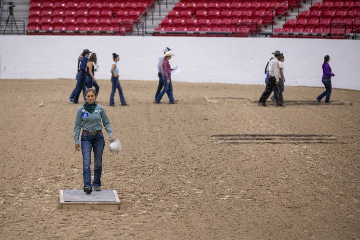 Competitors walk the Trail Class pattern before the Mustang Challenge at South Point Arena, Fri ...