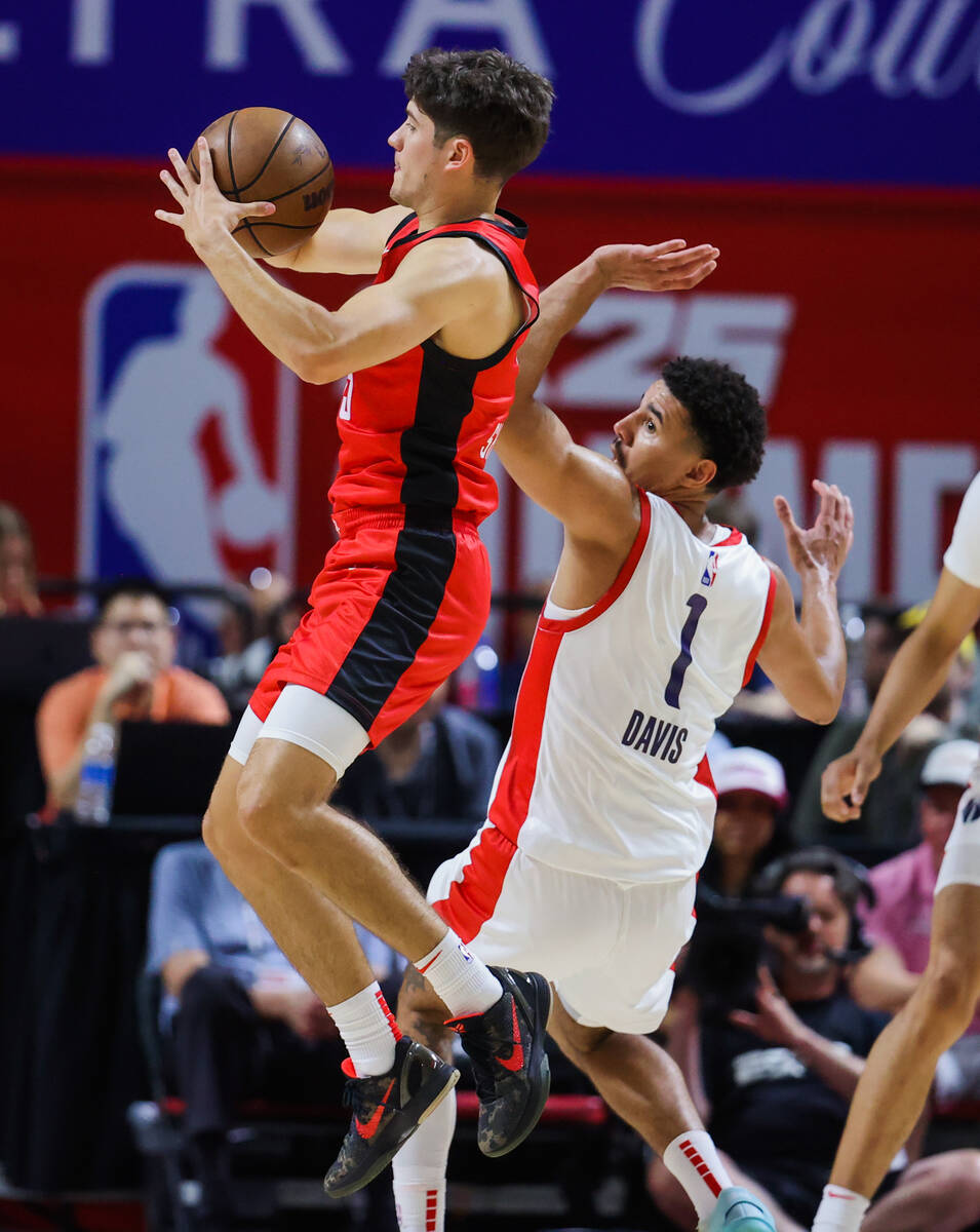 Houston Rockets guard Reed Sheppard (15) jumps into the air to pass the ball as Washington Wiza ...