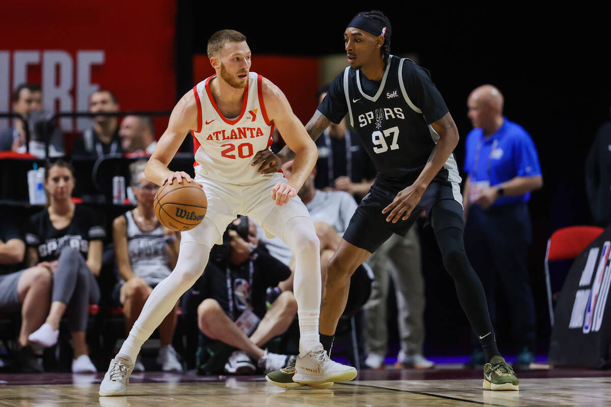 Atlanta Hawks forward Dylan Windler (20) dribbles the ball as San Antonio Spurs forward Donovan ...