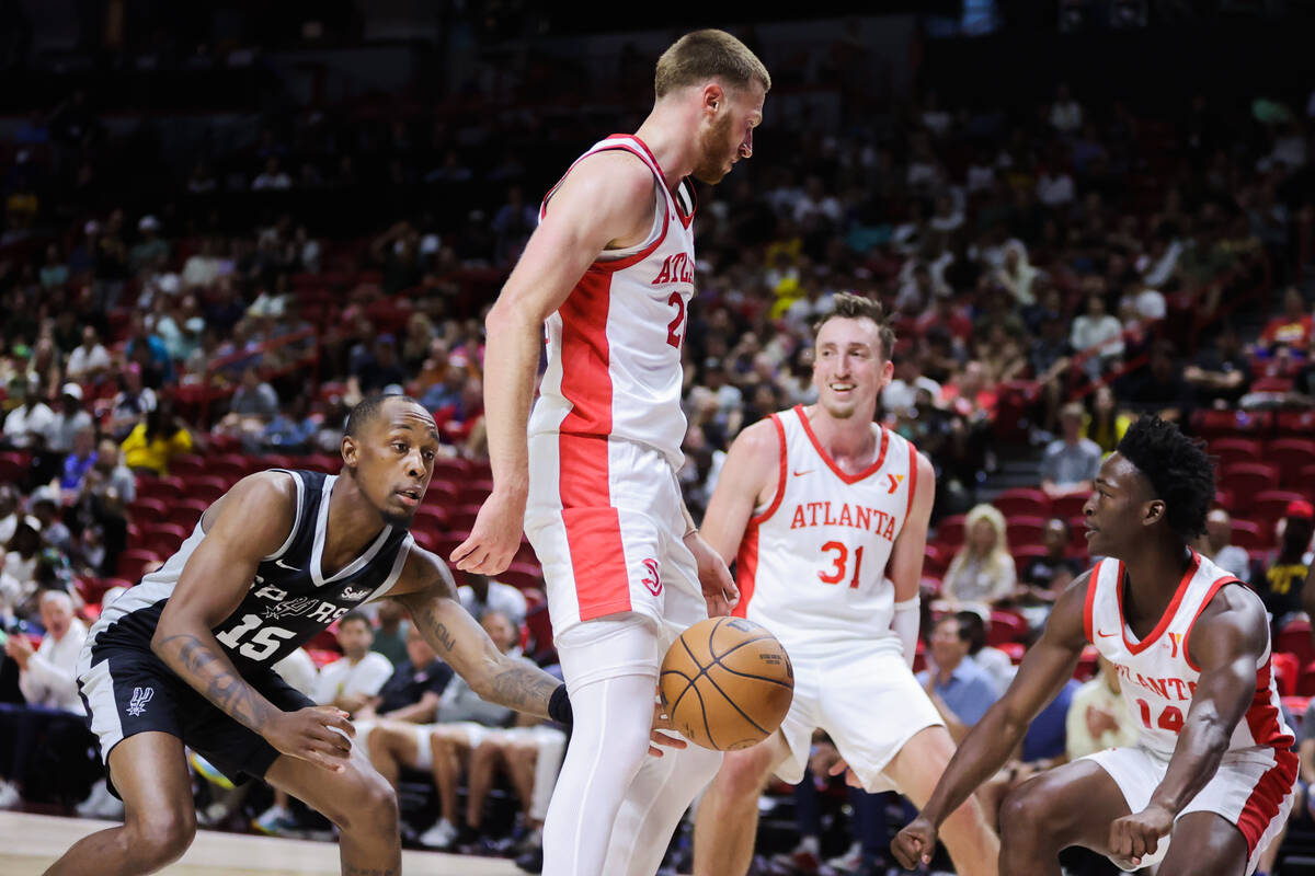 San Antonio Spurs guard Jamaree Bouyea (15) reaches the grab the ball through the legs of Atlan ...