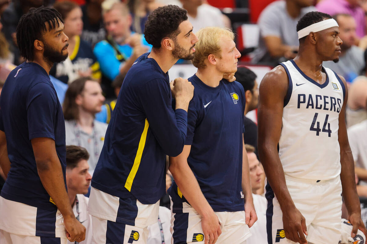 Trey Woodbury, second from right, watches on during an NBA Summer League game between the India ...