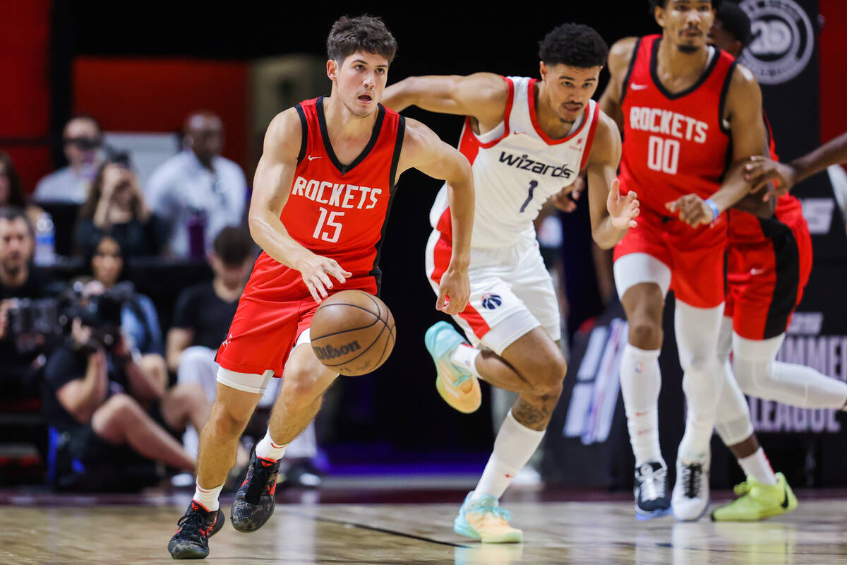 Houston Rockets guard Reed Sheppard (15) dribbles the ball during an NBA Summer League game bet ...