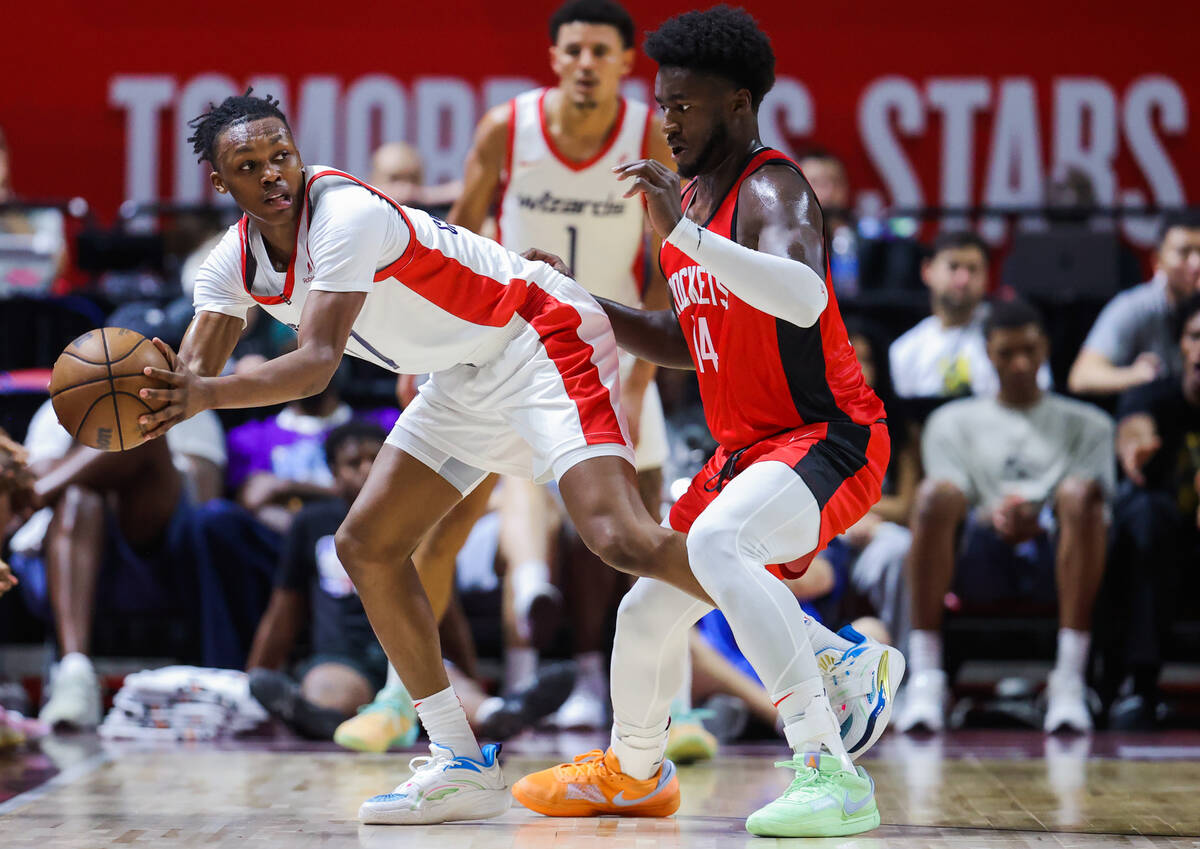 Washington Wizards guard Bub Carrington (17) keeps the ball from Houston Rockets guard/forward ...