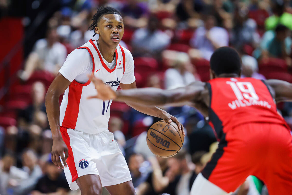 Washington Wizards guard Bub Carrington (17) looks to pass the ball during an NBA Summer League ...