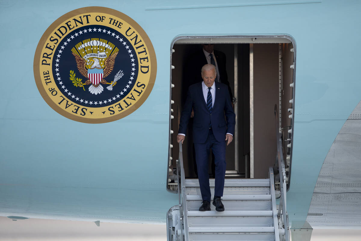 President Joe Biden exits Air Force One at Harry Reid International Airport, Monday, July 15, 2 ...