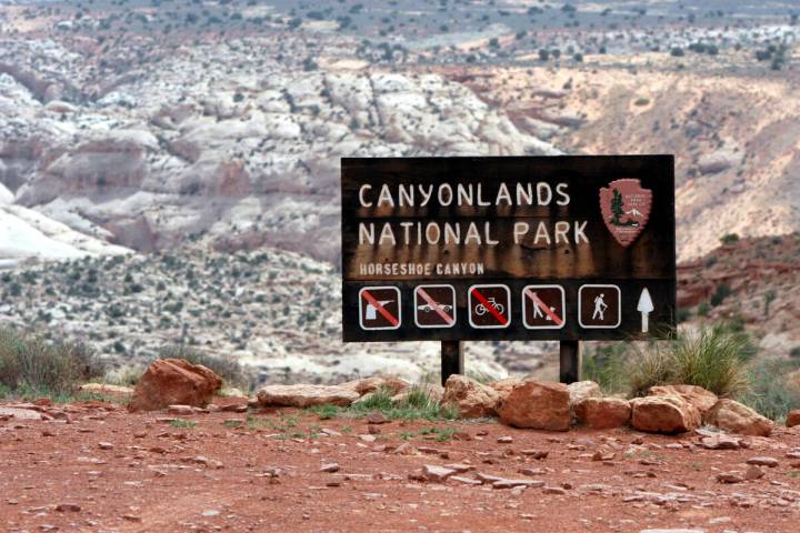 A sign for Canyonlands National Park is seen, May 6, 2003, in Moab, Utah. (AP Photo/Mickey Krak ...