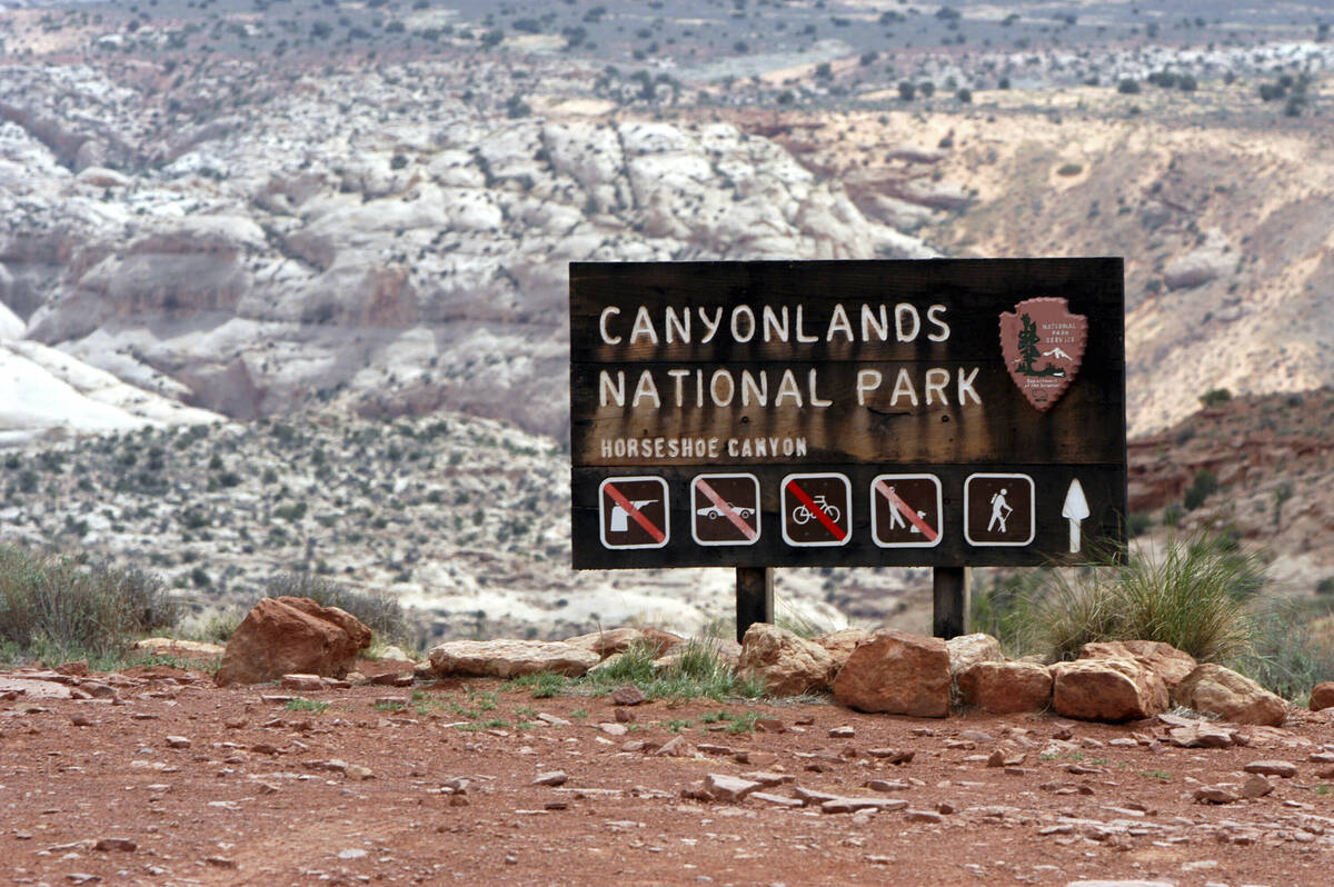 A sign for Canyonlands National Park is seen, May 6, 2003, in Moab, Utah. (AP Photo/Mickey Krak ...