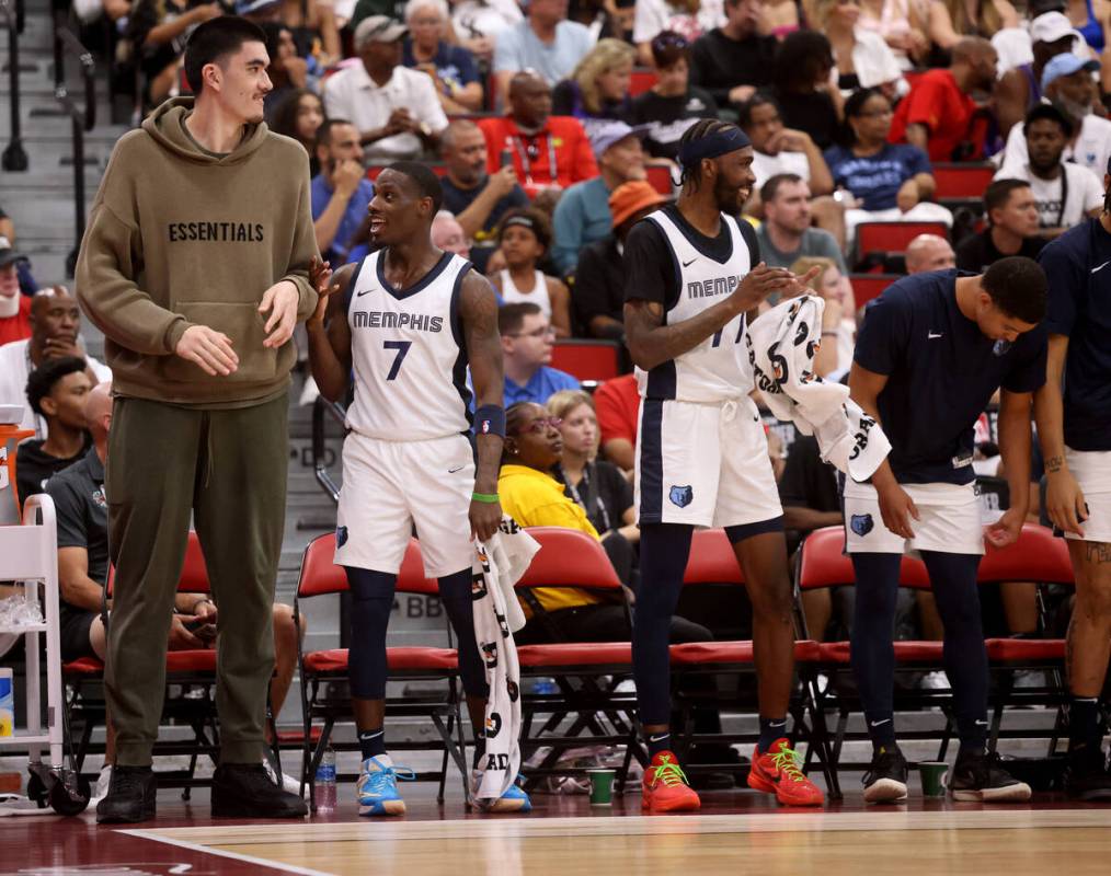 Memphis center Zach Edey, left, watches his team take on the Dallas Mavericks during an NBA Sum ...