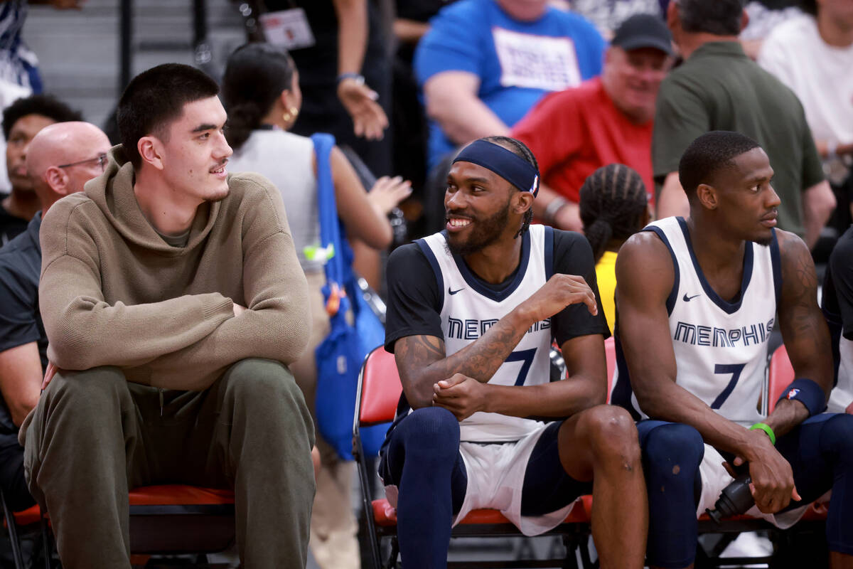 Memphis center Zach Edey, left, watches his team take on the Dallas Mavericks during an NBA Sum ...