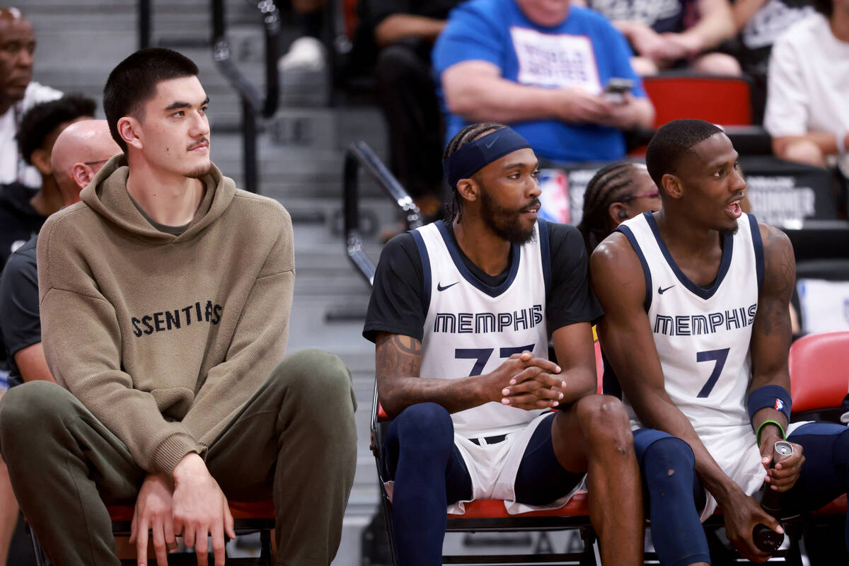 Memphis center Zach Edey, left, watches his team take on the Dallas Mavericks during an NBA Sum ...