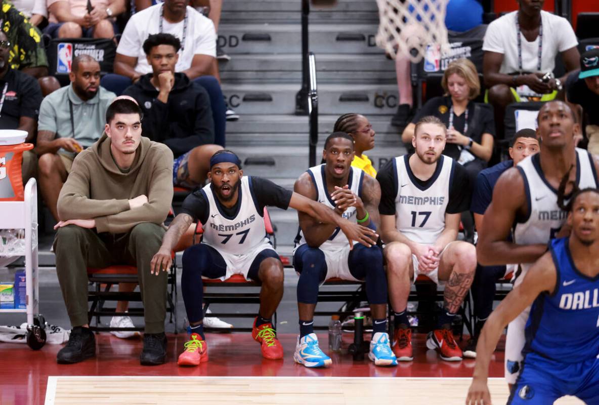 Memphis center Zach Edey, left, watches his team take on the Dallas Mavericks during an NBA Sum ...